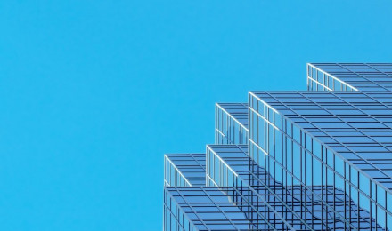 White and blue concrete building under blue sky during daytime photo