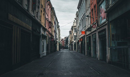 Empty road between concrete buildings under white clouds during daytime, HD phone wallpaper