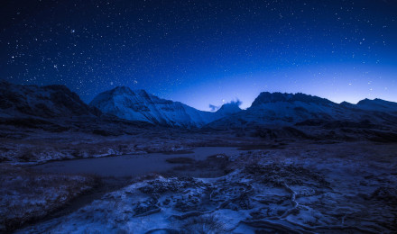 Starry night sky above the snowy mountains Wallpaper 4k Ultra HD