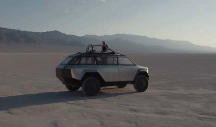 A Tesla Cybertruck concept car parked in a desert