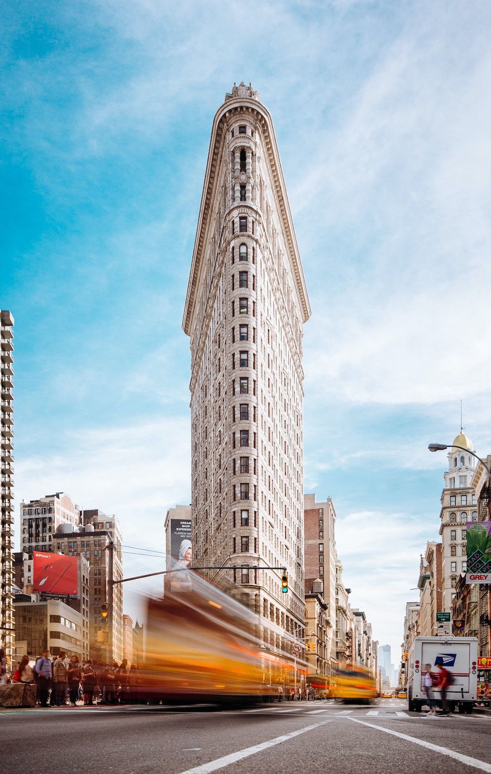 Beige concrete building near cars photo