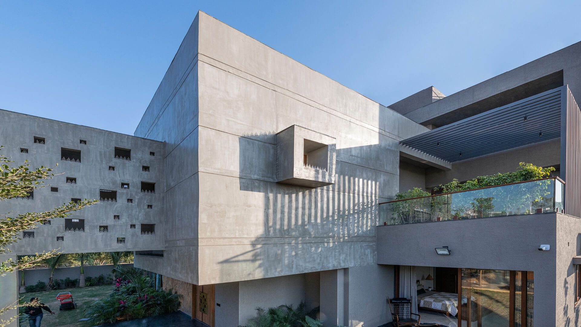 The Grid Architects erect sweeping concrete volumes with Pixel House in India