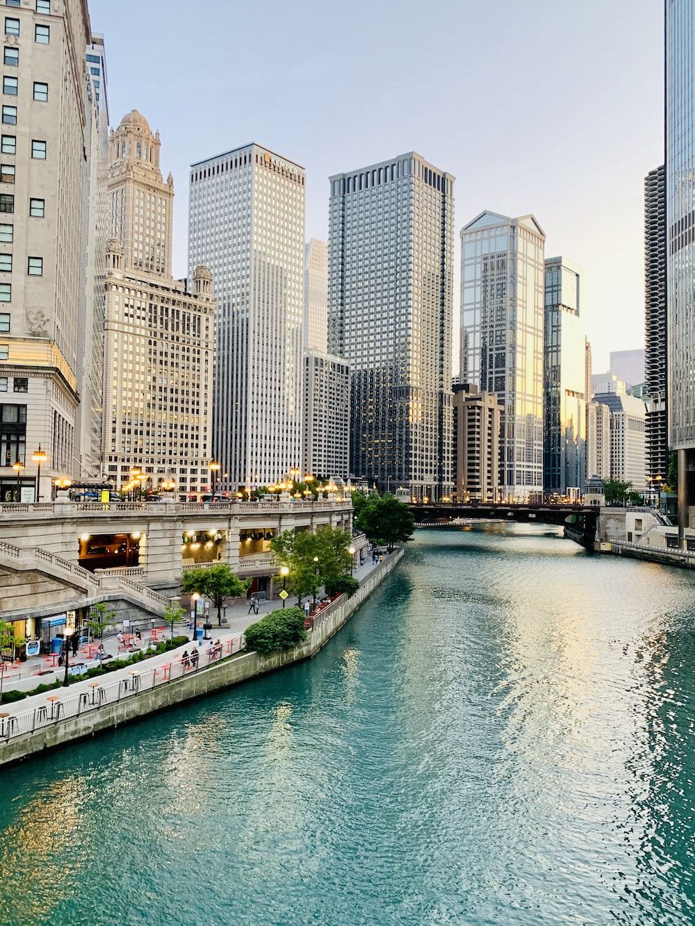 White and brown concrete buildings near body of water during daytime photo