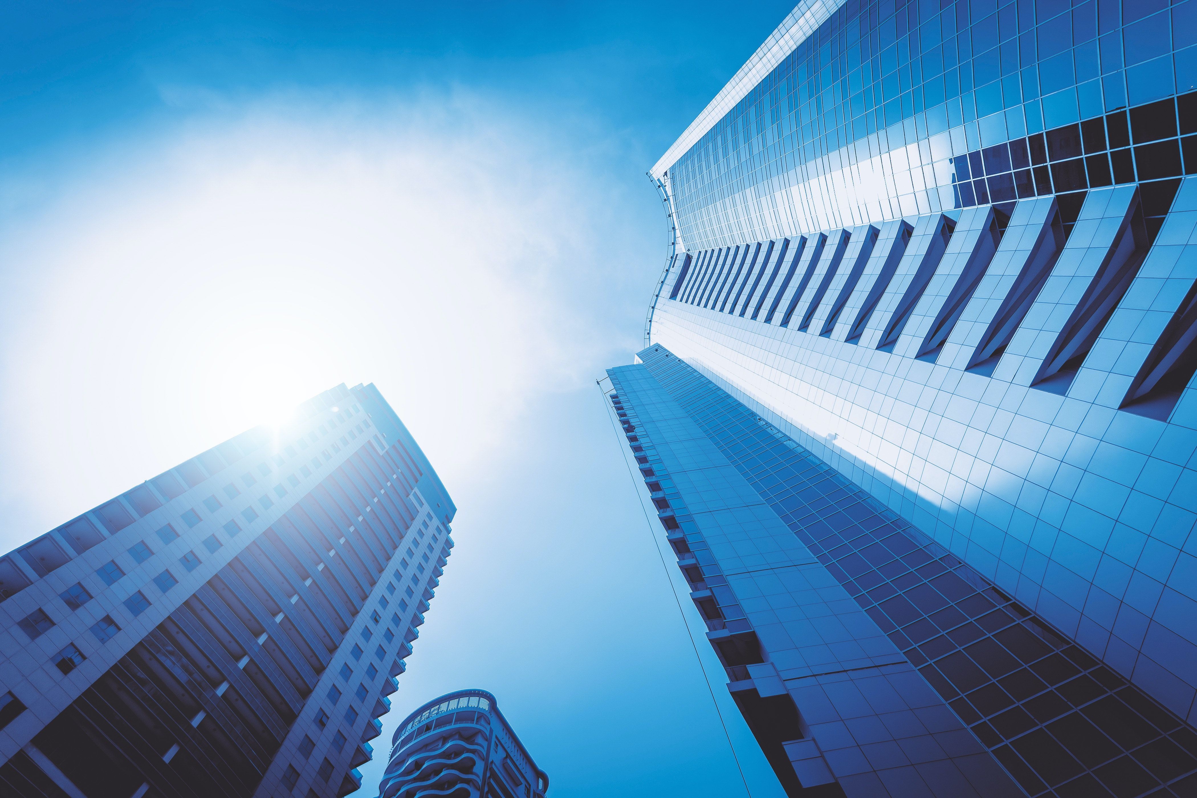 Concrete High Rise Buildings Under Blue Sky · Free