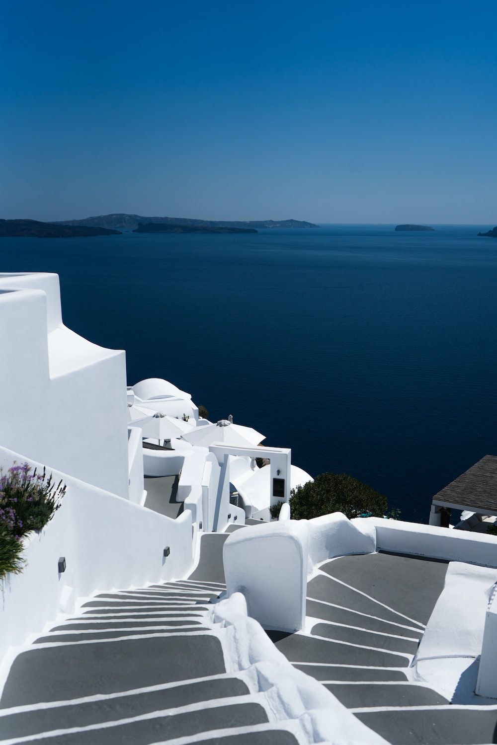 White concrete building near body of water during daytime photo