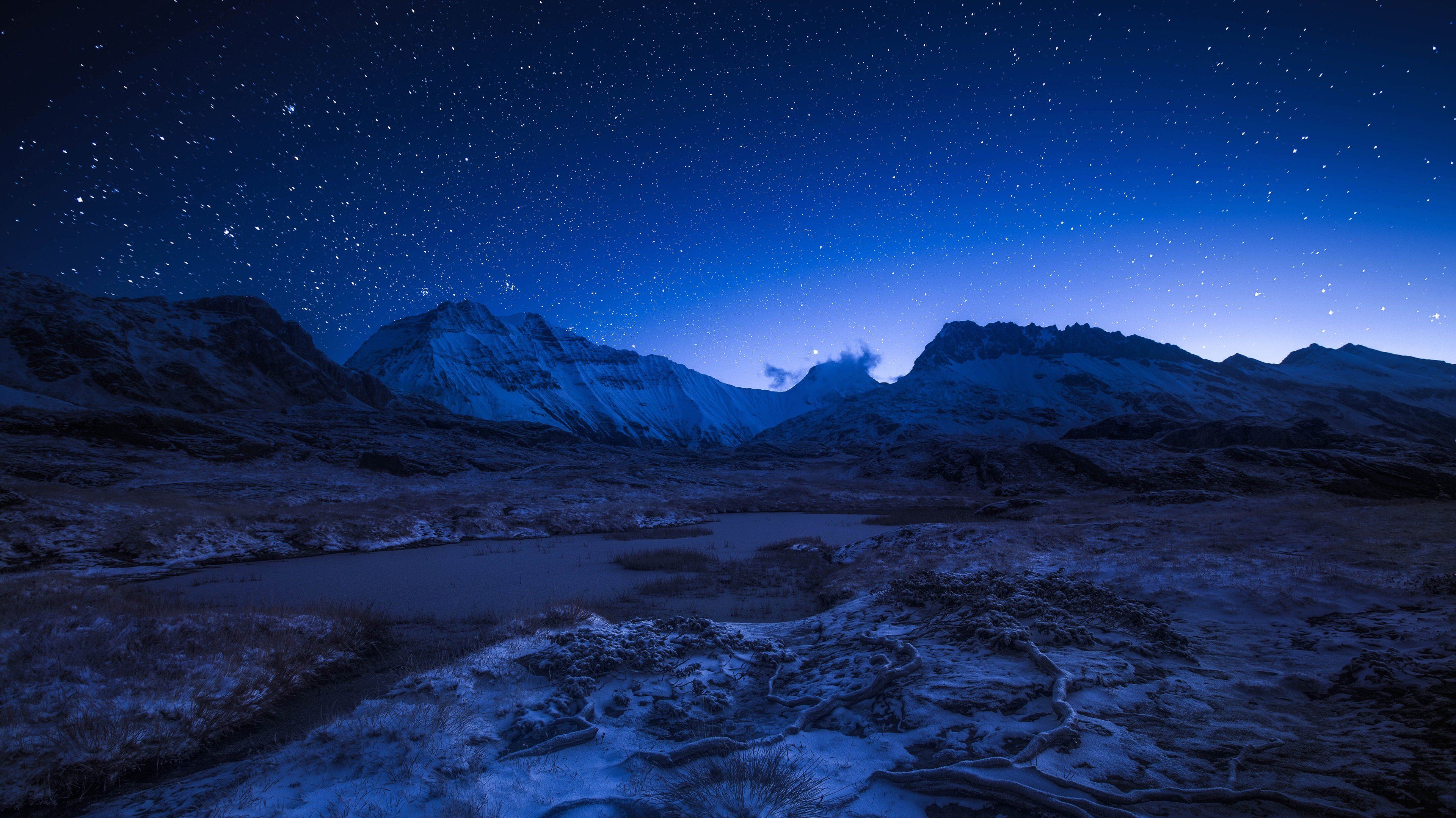 Starry night sky above the snowy mountains Wallpaper 4k Ultra HD - mountains